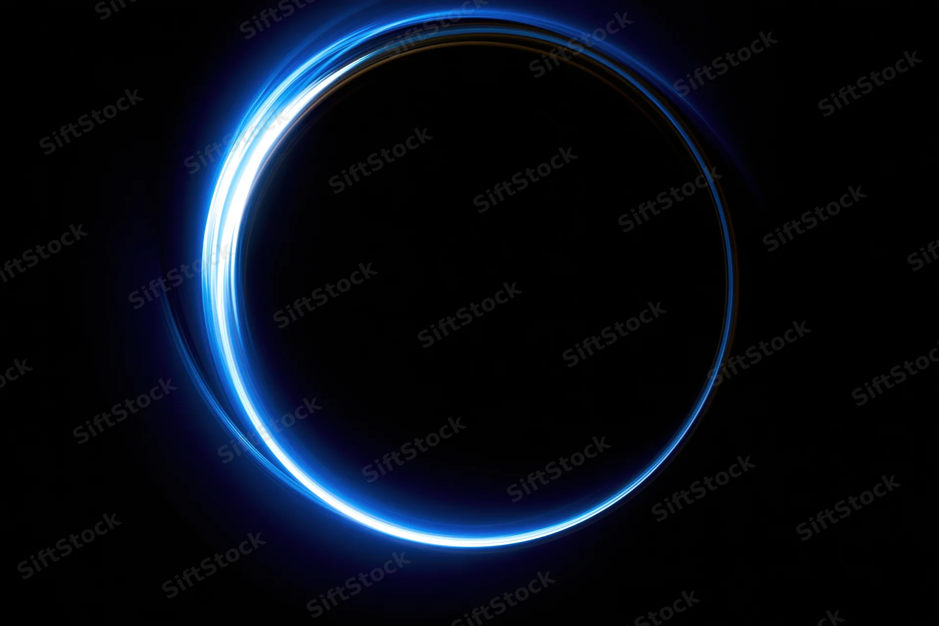 Glowing blue circular light ring on dark background with long-exposure light painting effect