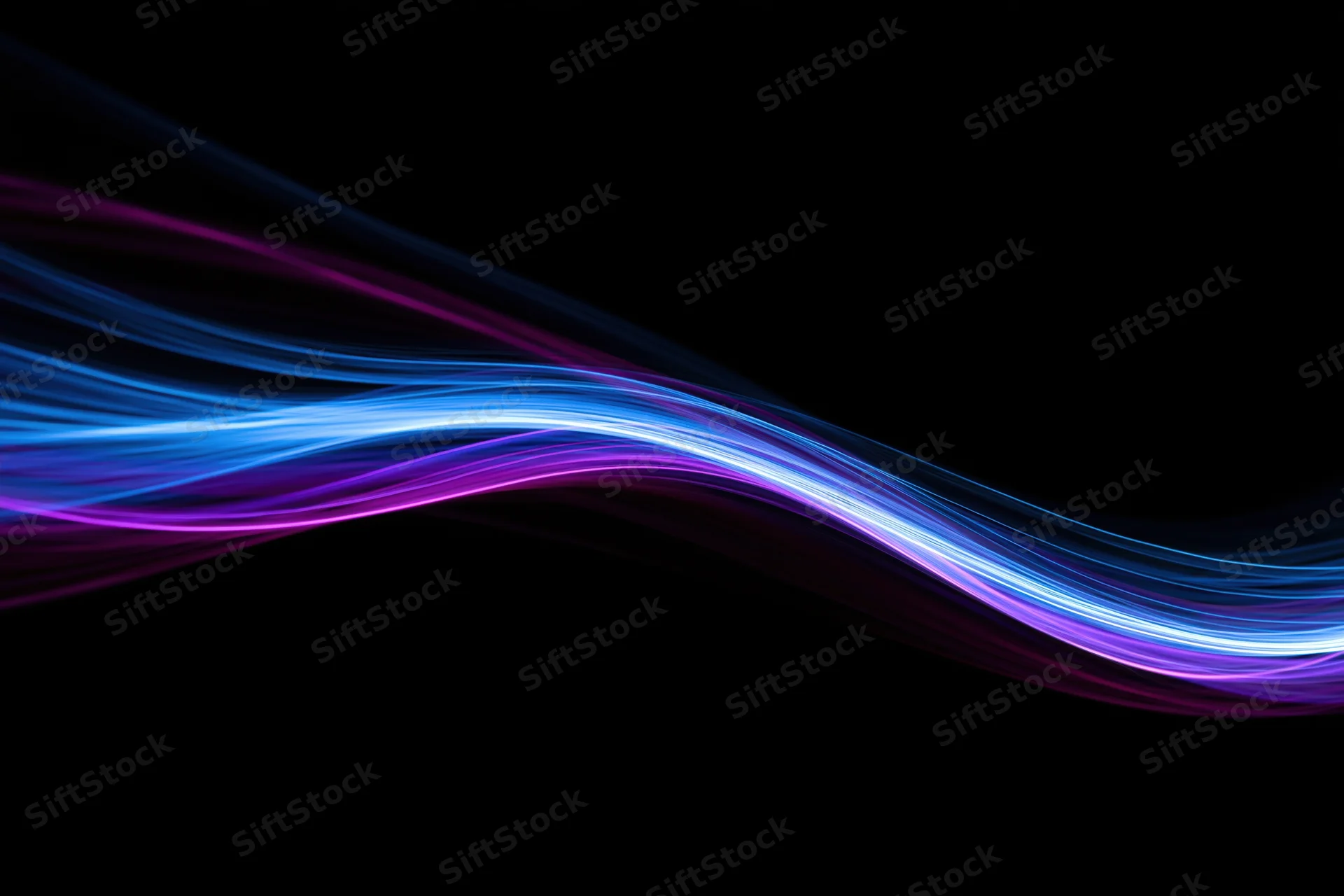 Glowing fiber-optic light waves flowing across a dark background in long-exposure light painting photography