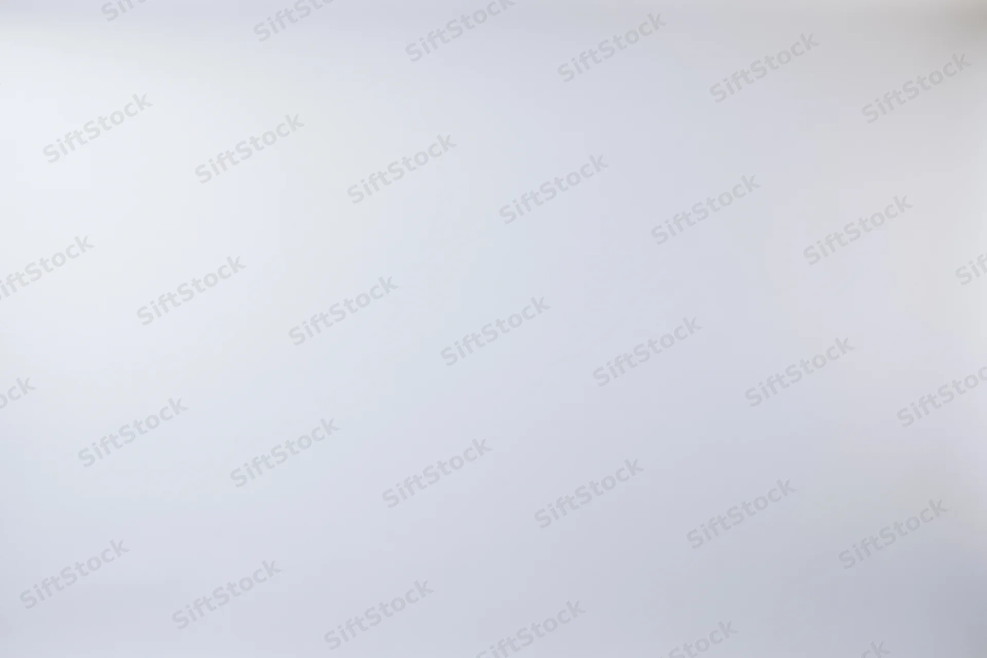 Plain white studio backdrop with soft gradient and even tone