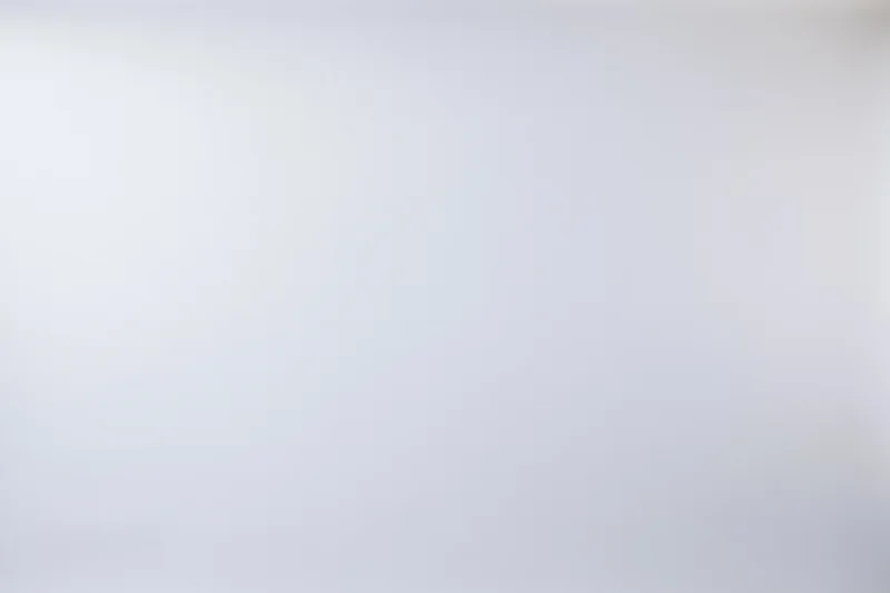 Plain white studio backdrop with soft gradient and even tone