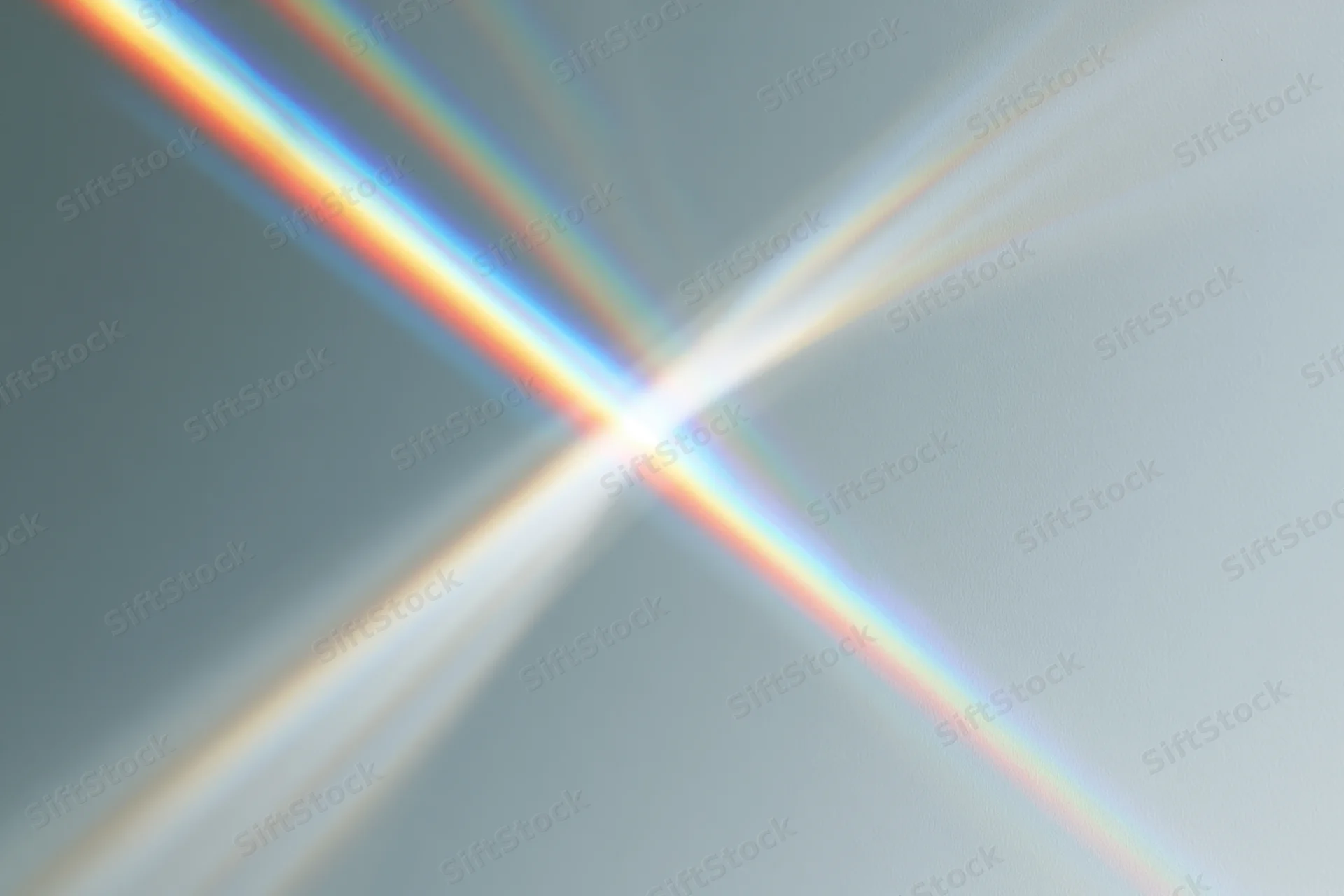 Prismatic light rays refracting across a plain pale grey-white background