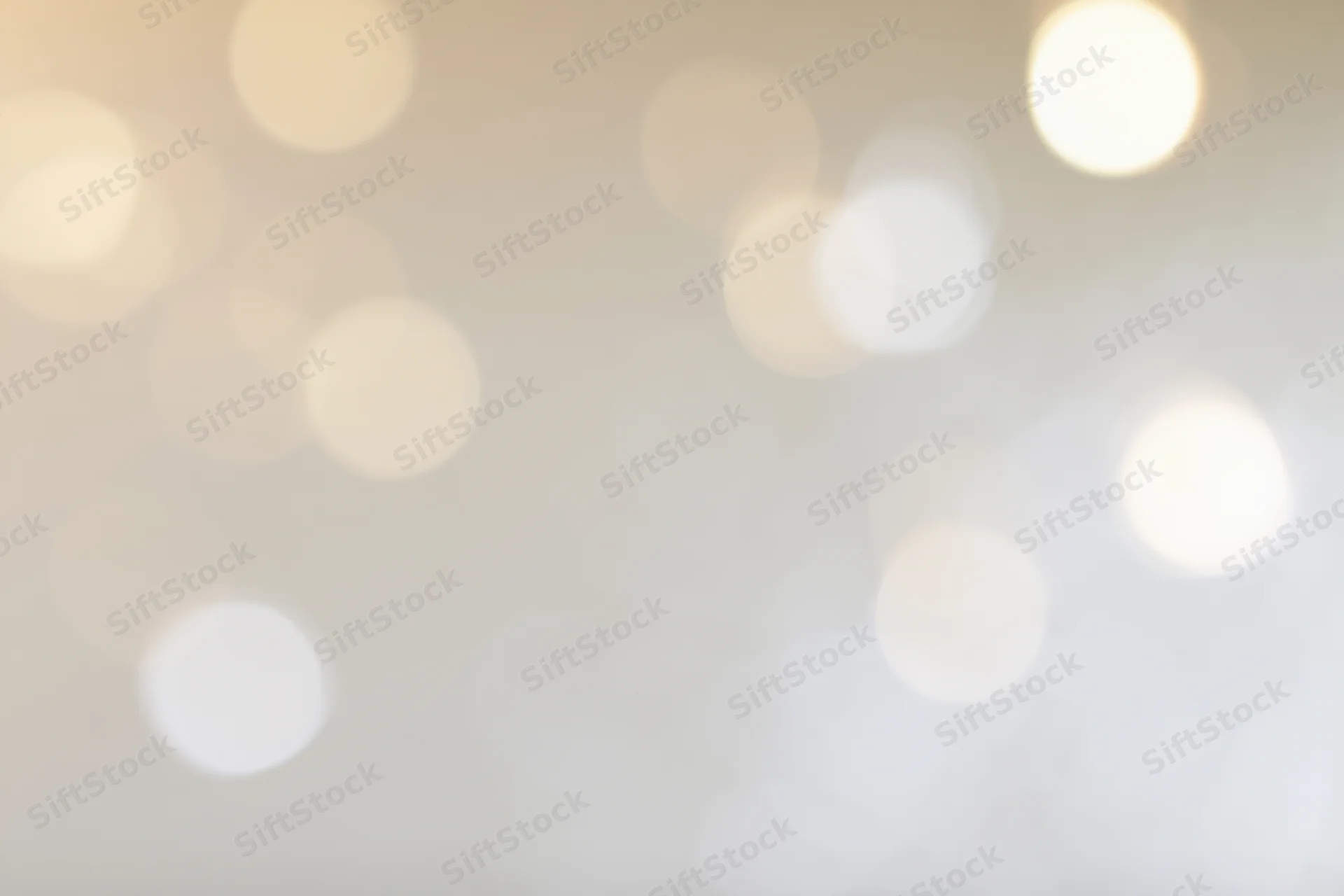 Soft out-of-focus bokeh background with scattered warm white lights