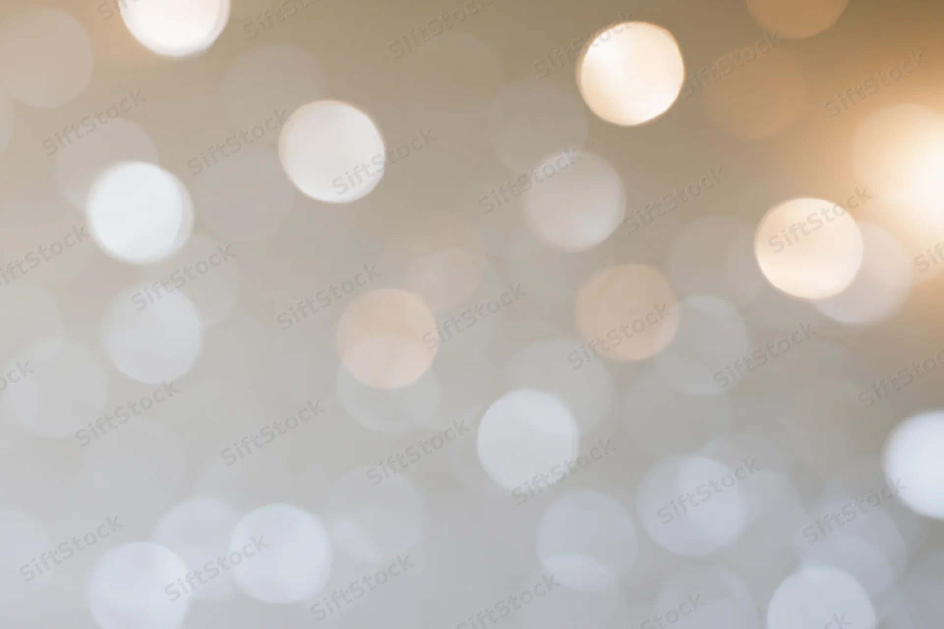 Soft out of focus bokeh lights scattered across a warm white background with circular glows and subtle gradient