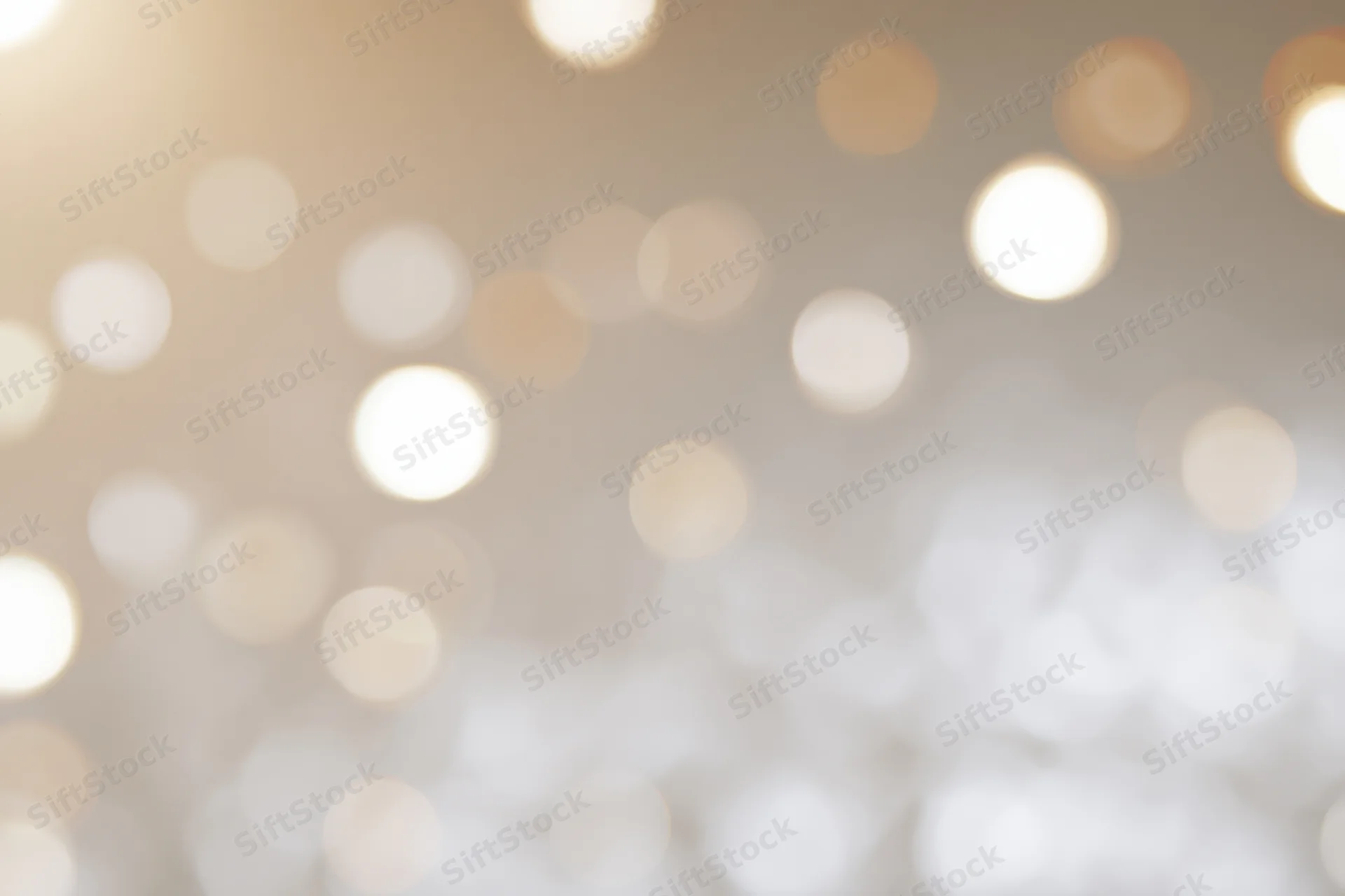 Soft out-of-focus bokeh background with scattered warm white lights