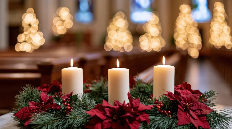 Three white pillar candles burning in an advent wreath of pine and poinsettia inside a church with blurred festive lights in the background