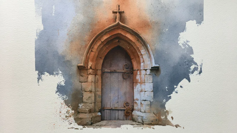 Old stone church doorway with arched gothic entrance and wooden door under a cross
