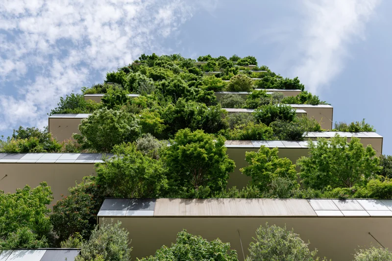 Bosco Verticale residential tower facade covered in dense trees