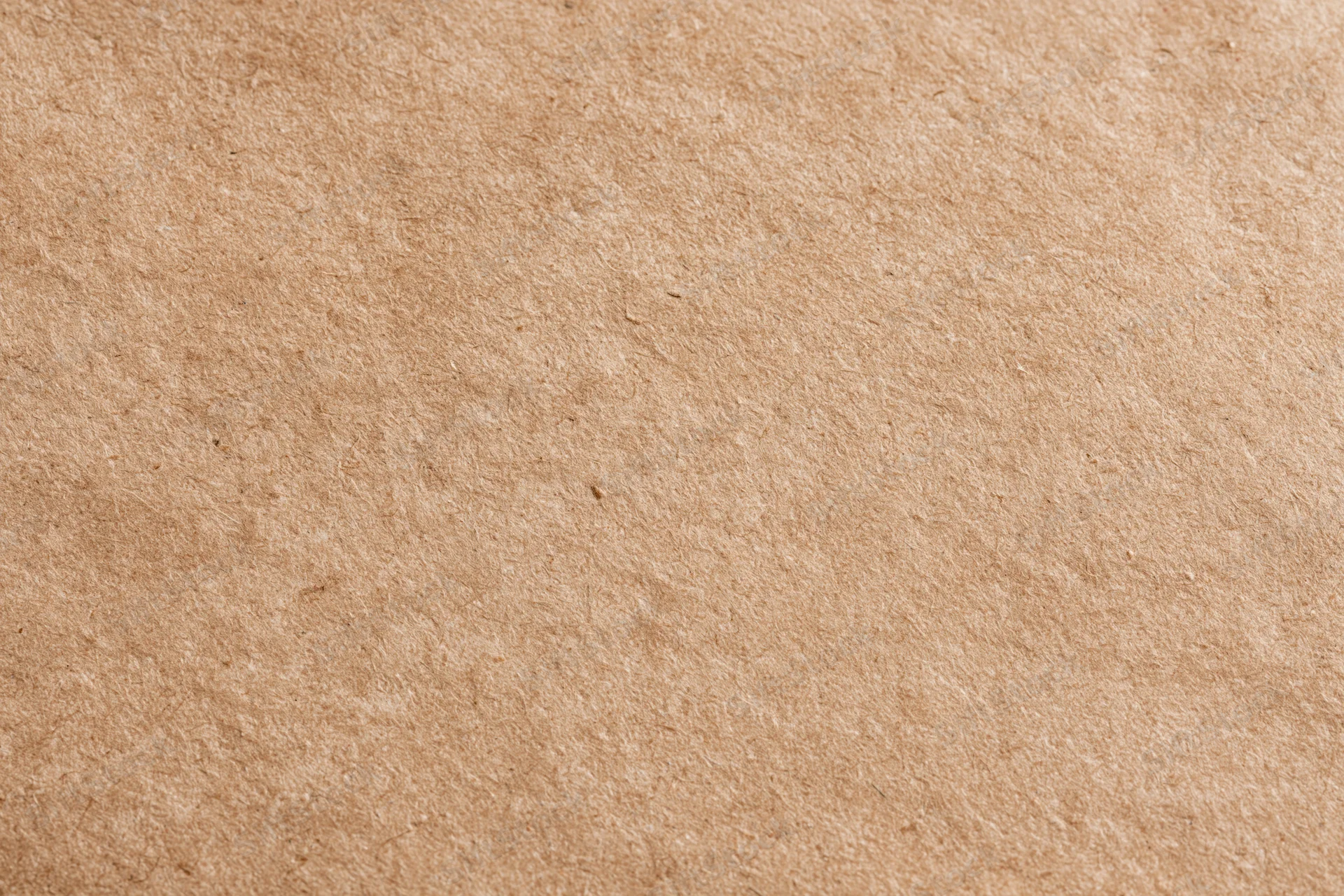 Close-up flat lay of plain kraft cardboard surface filling the frame