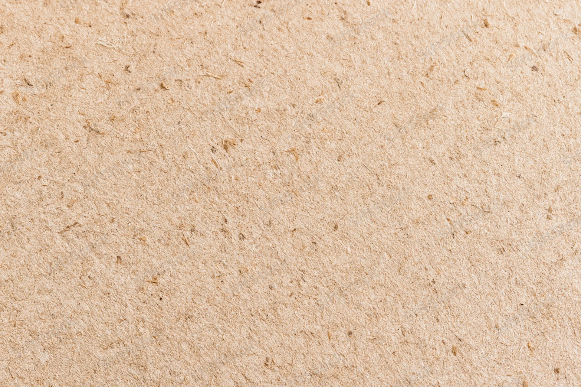 Close-up flat lay of recycled kraft cardboard surface filling the frame