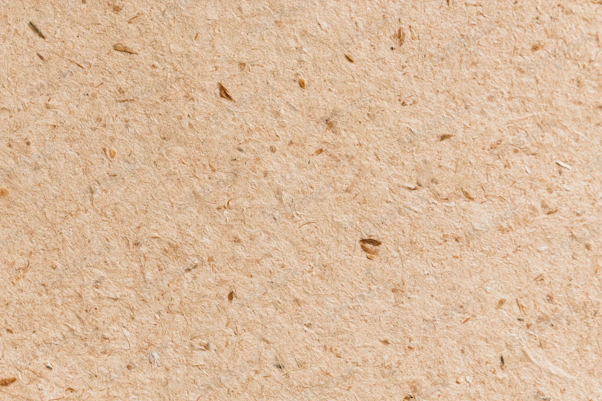 Close-up flat lay of recycled kraft paper surface filling the frame