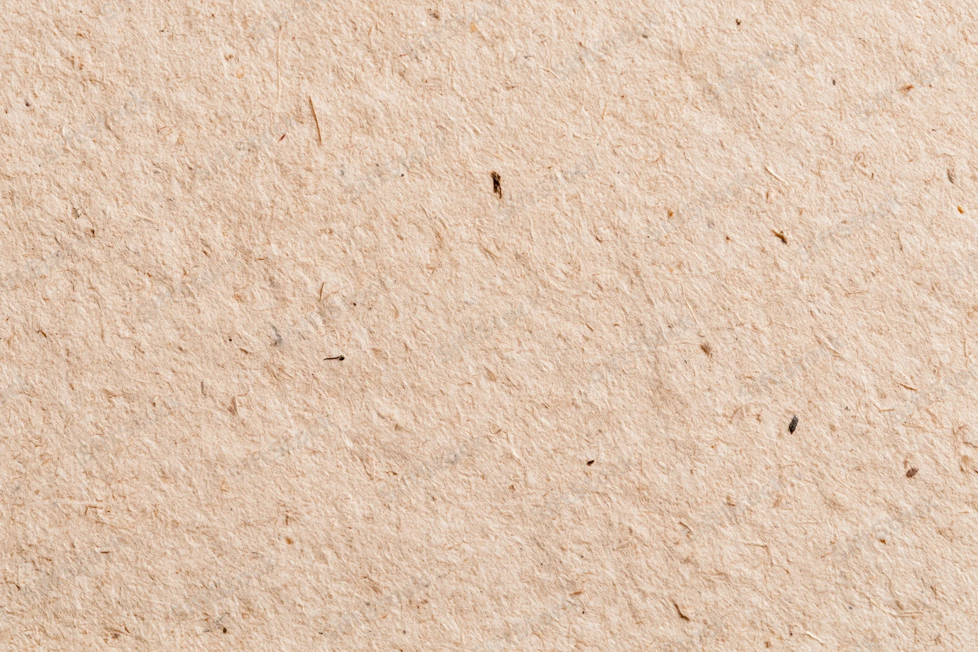 Close-up flat lay of recycled kraft paper surface filling the frame
