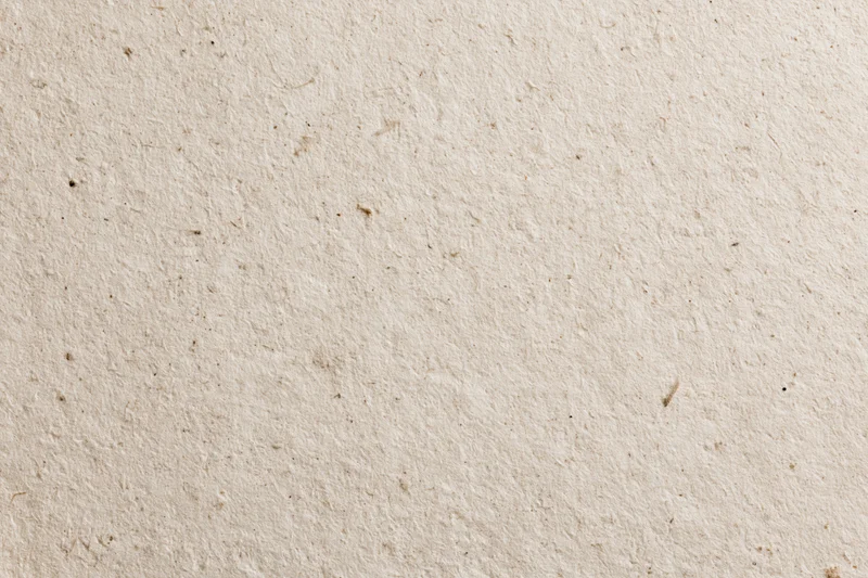 Close-up flat lay of recycled kraft paper surface filling the frame