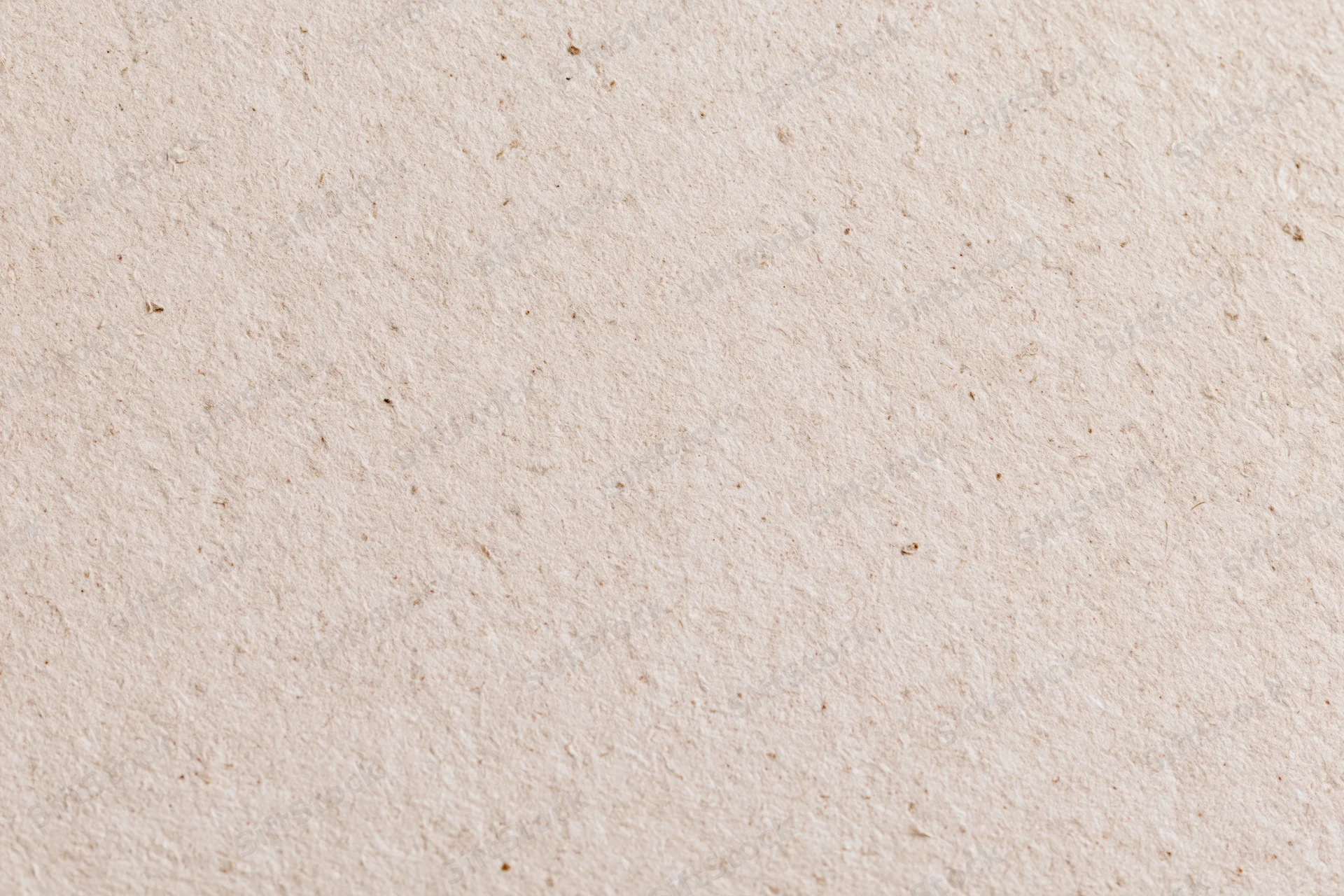 Close-up flat lay of recycled kraft paper surface filling the frame