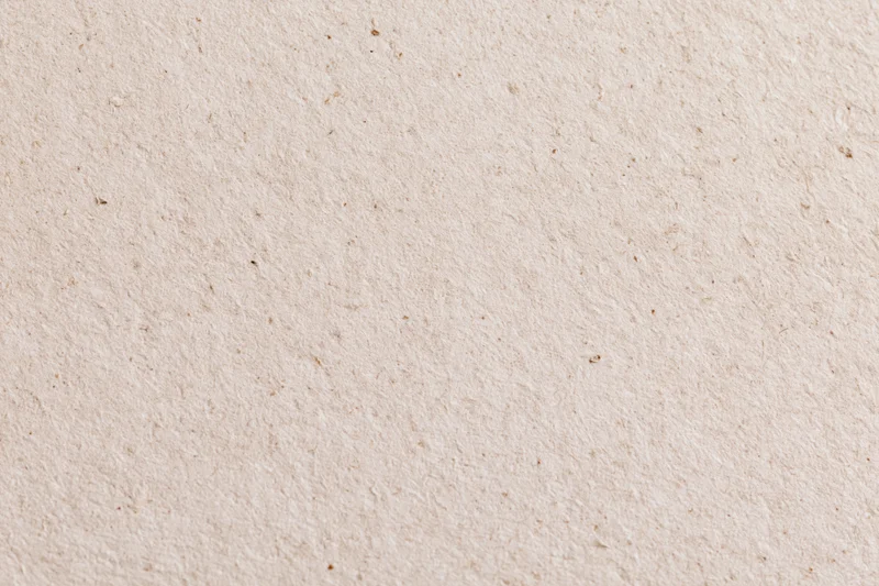 Close-up flat lay of recycled kraft paper surface filling the frame
