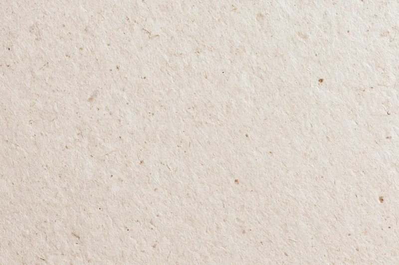Close-up flat lay of recycled kraft paper surface filling the frame