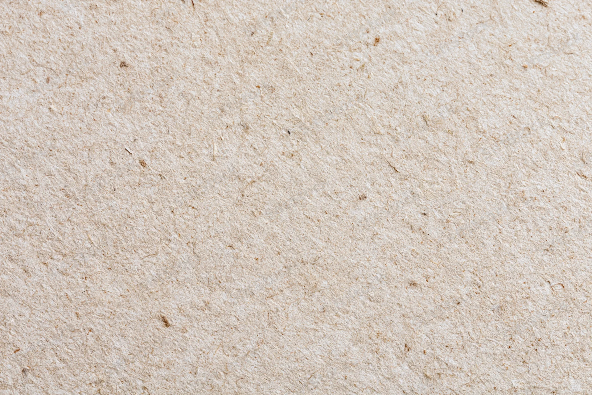 Close-up flat lay of recycled kraft paper surface filling the frame