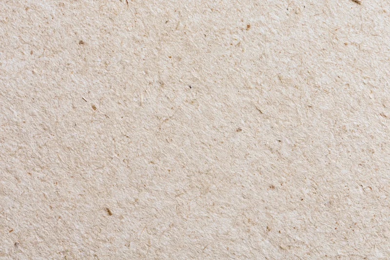 Close-up flat lay of recycled kraft paper surface filling the frame