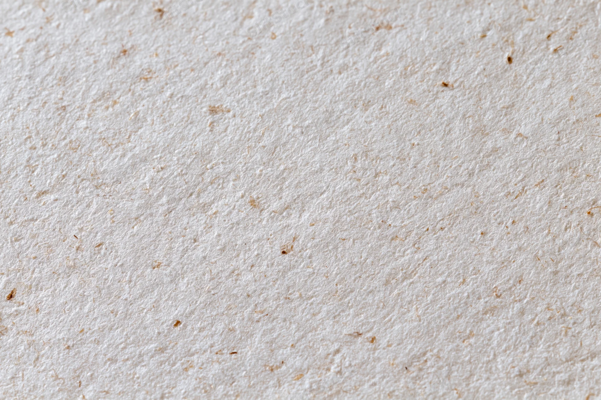 Close-up flat lay of recycled kraft paper surface filling the frame