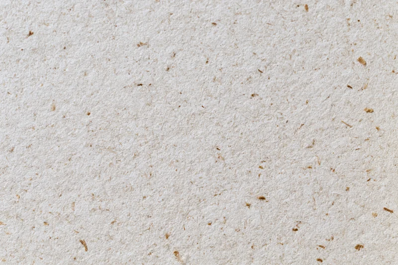 Close-up flat lay of recycled kraft paper surface filling the frame
