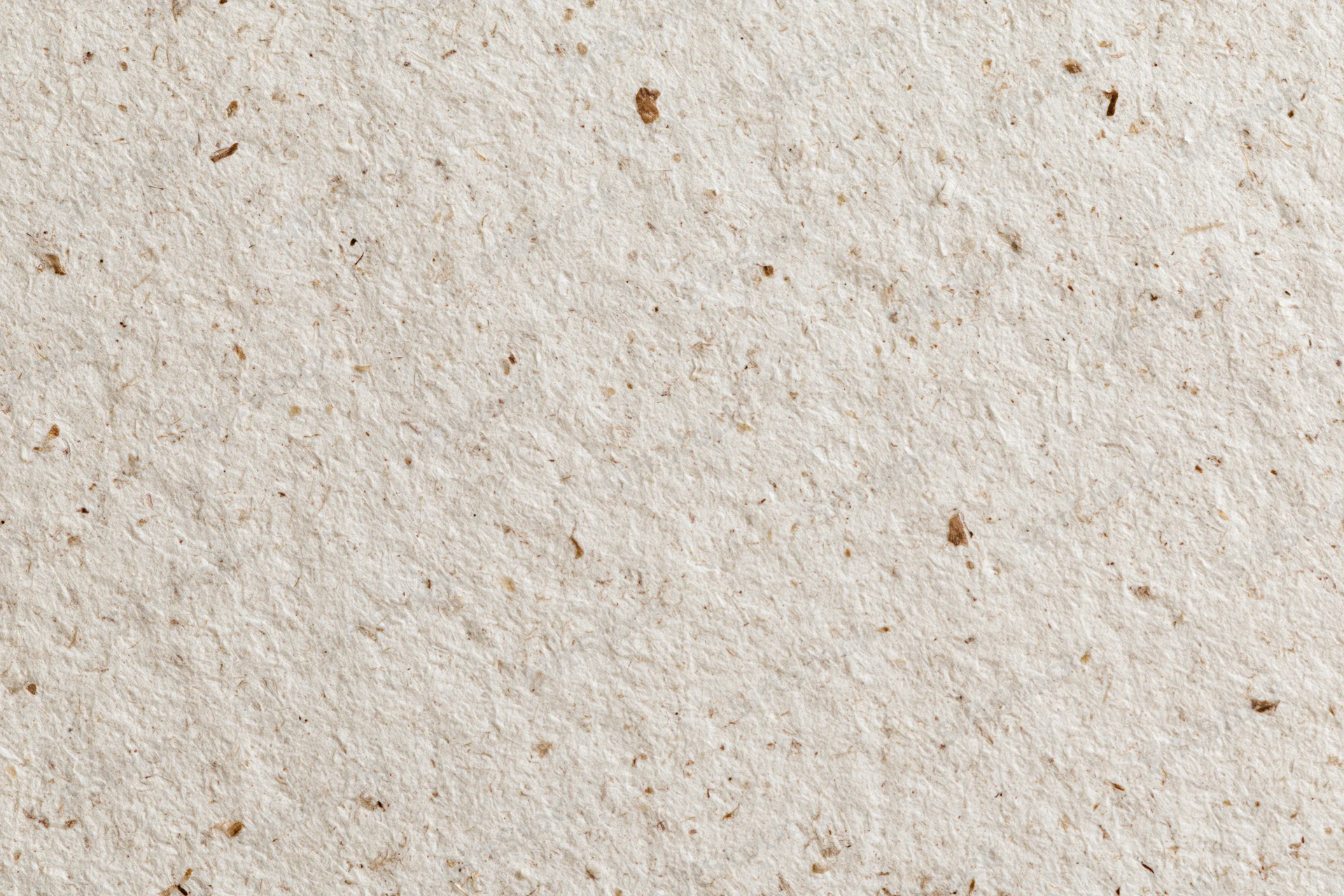 Close-up flat lay of recycled kraft paper surface filling the frame