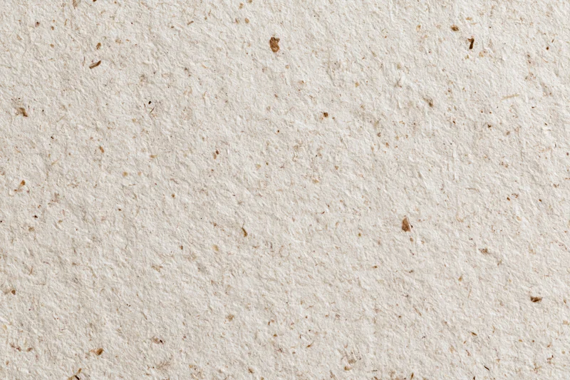 Close-up flat lay of recycled kraft paper surface filling the frame