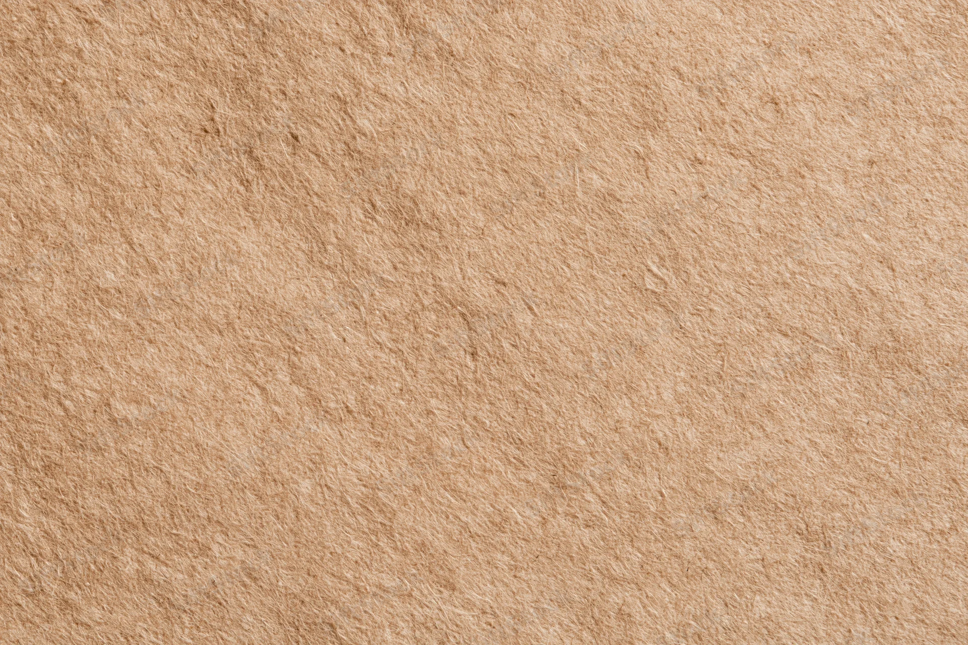 Close-up flat lay of recycled kraft paper surface filling the frame