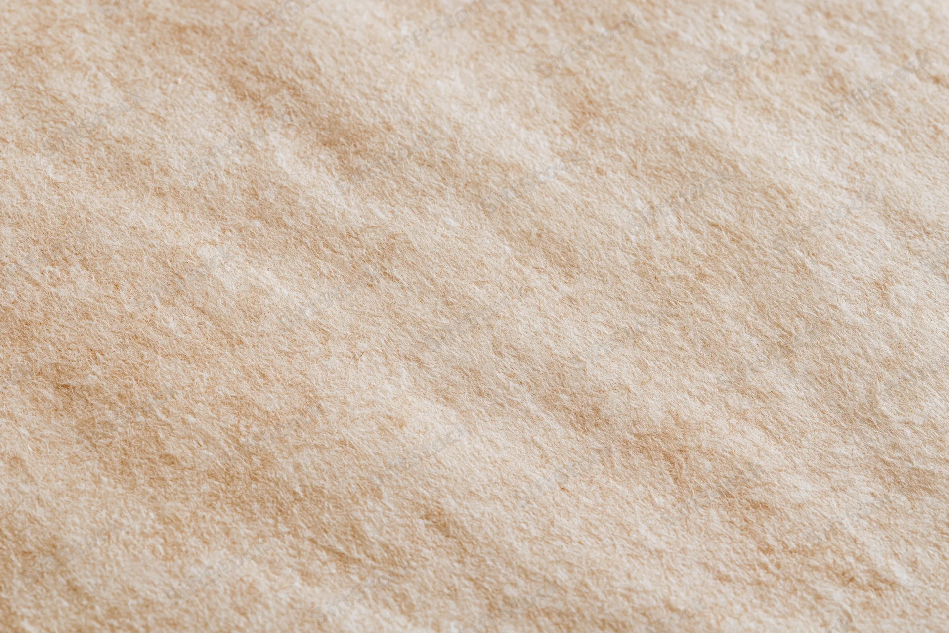 Close-up flat lay of unbleached kraft paper surface filling frame