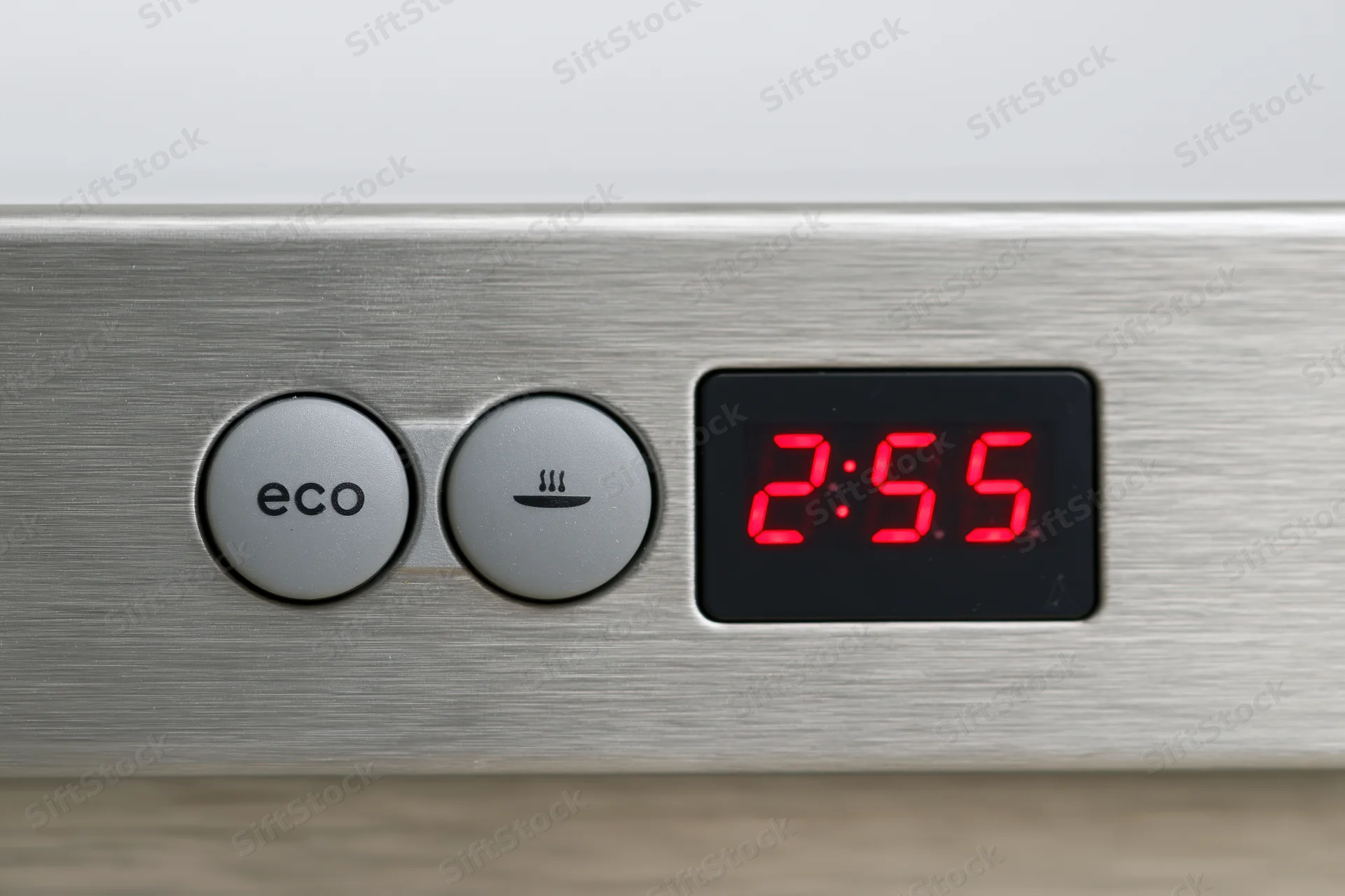 Close-up of a dishwasher control panel with two grey buttons and a red digital timer display showing 2:55