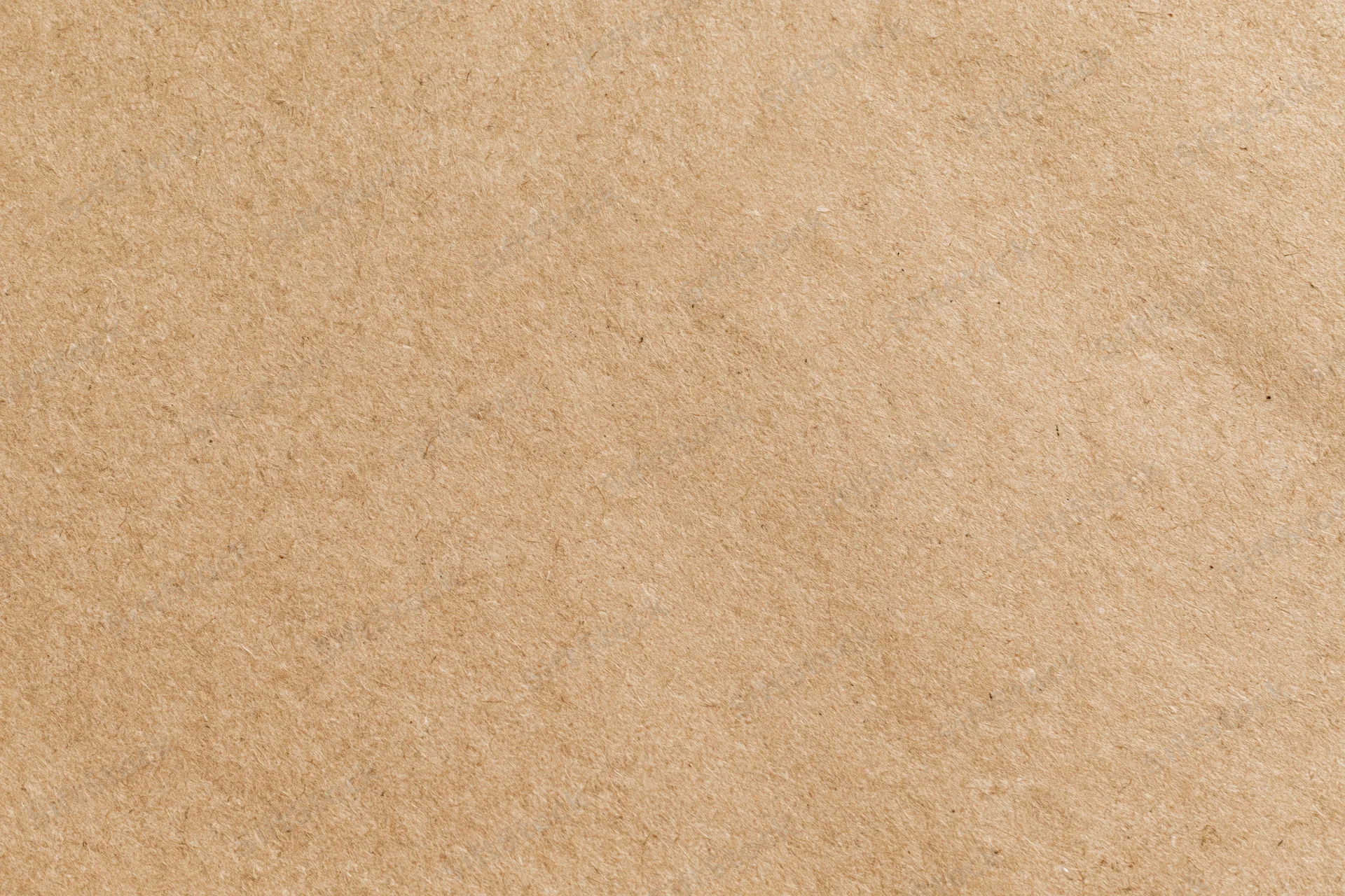 Flat close-up of a plain kraft brown paper sheet filling the frame