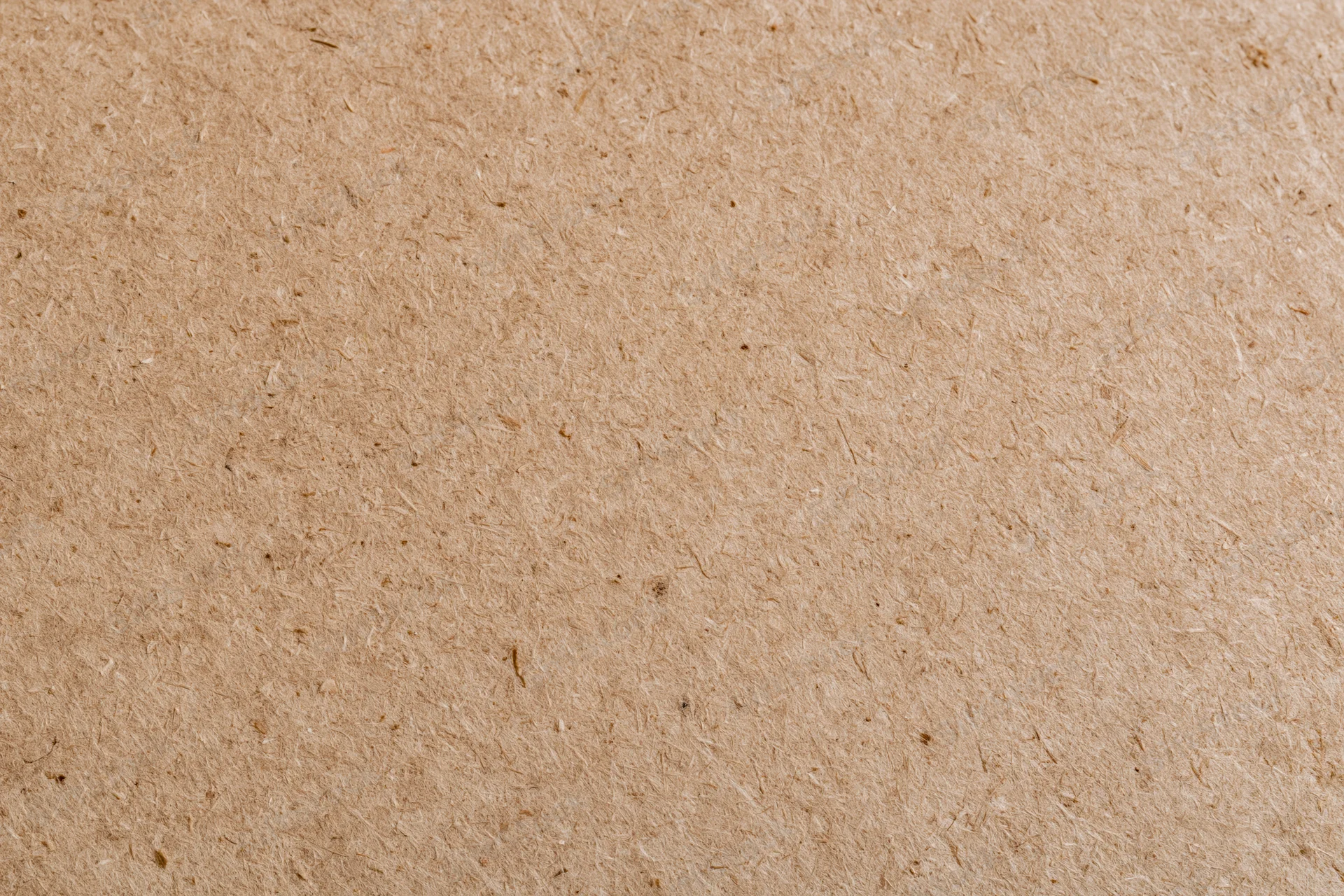 Smooth mdf or hardboard surface filling the frame in a flat lay closeup
