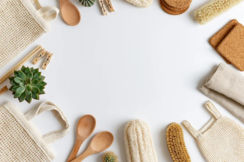Zero-waste household items arranged in a border frame on white background