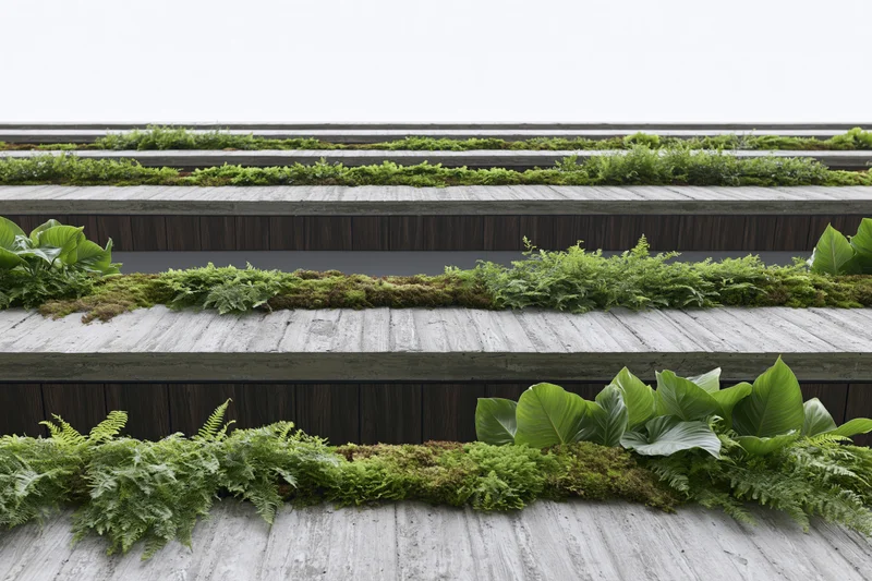 Modern building facade with layered greenery growing on concrete and wood tiers