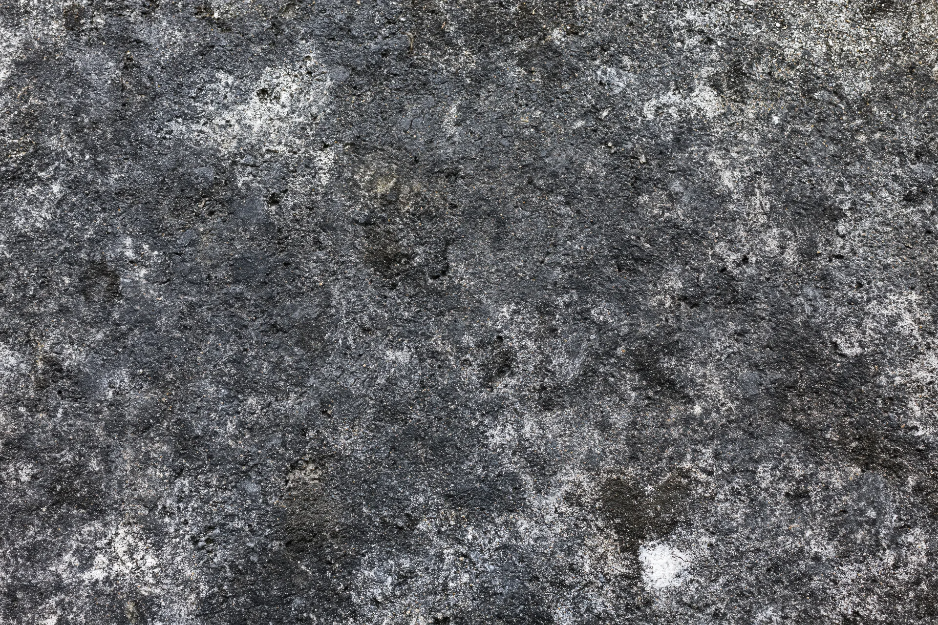 Aged concrete surface photographed flat and straight-on filling the frame