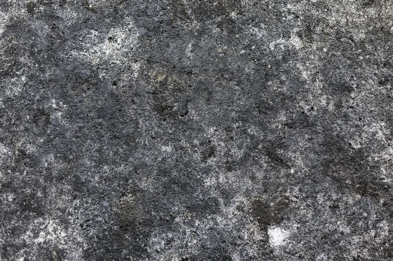 Aged concrete surface photographed flat and straight-on filling the frame