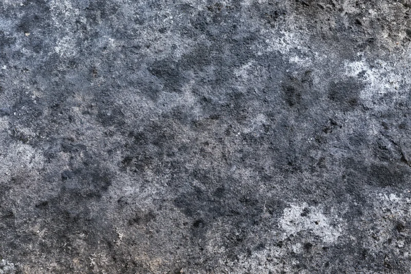 Aged concrete surface photographed flat and straight-on filling the frame