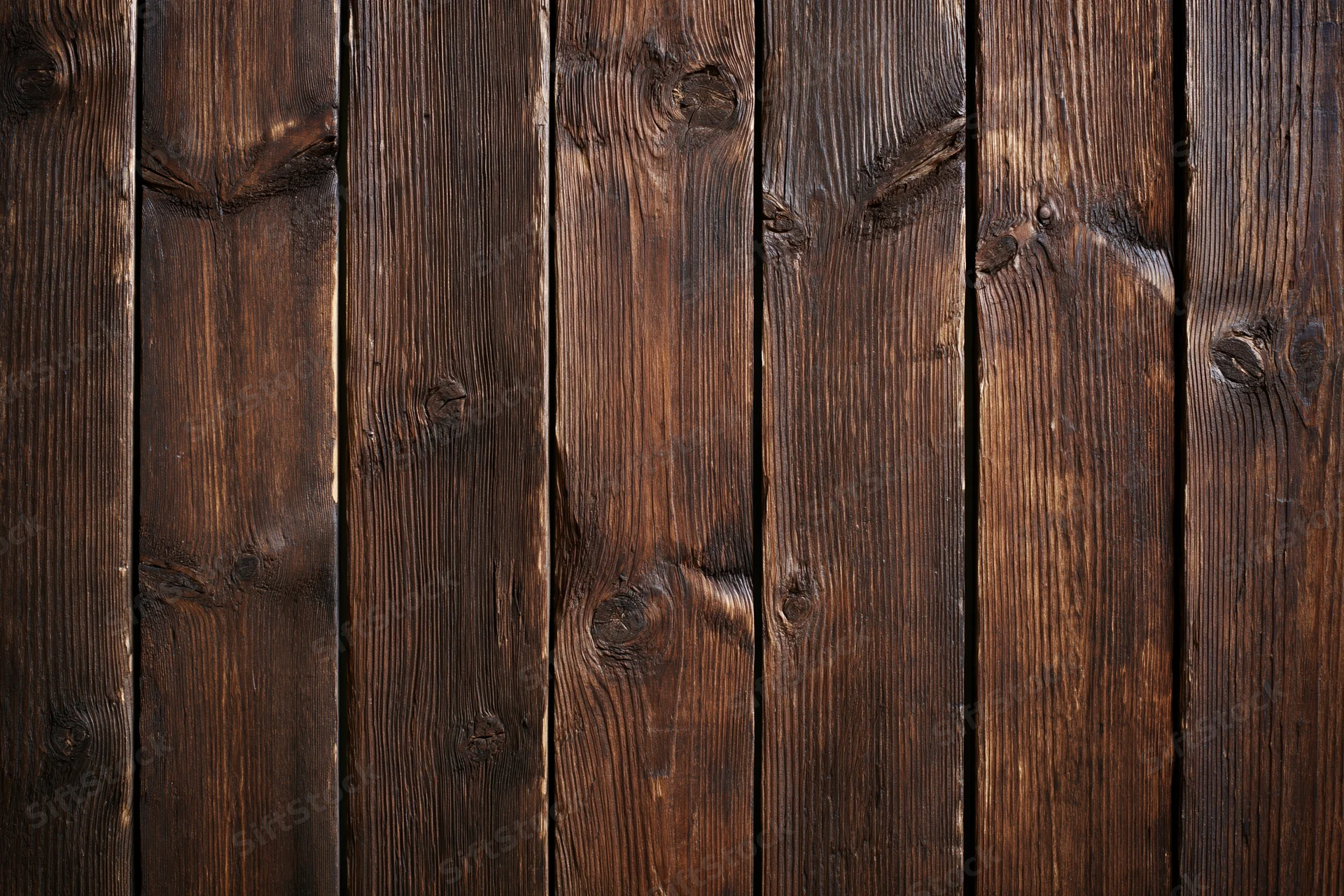 Aged vertical wooden planks arranged in a flat-lay pattern filling the frame