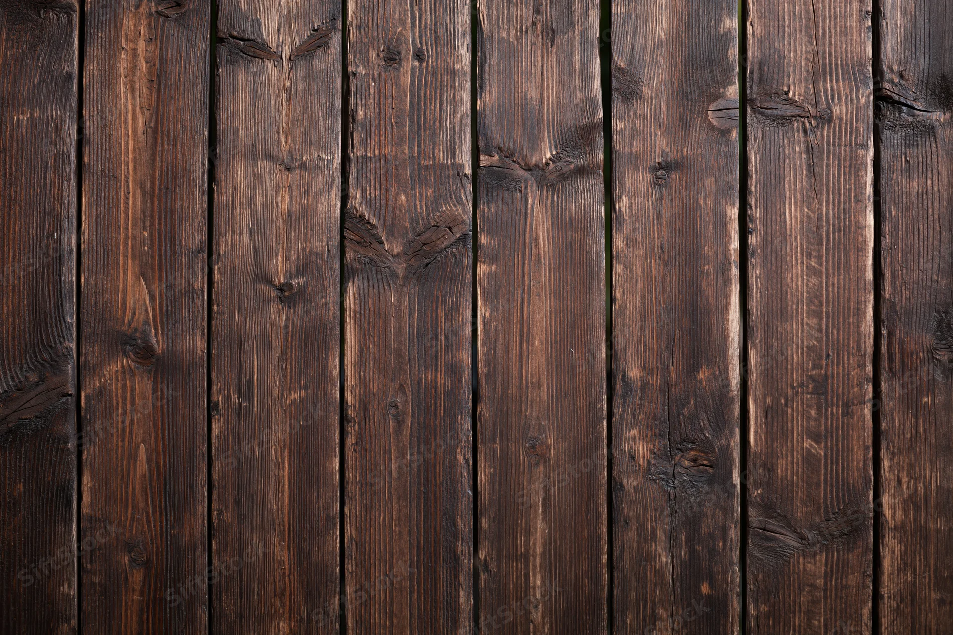 Vertical aged wooden planks arranged in a flat-lay pattern filling the frame