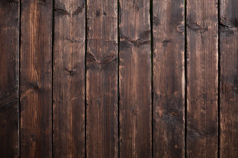 Vertical aged wooden planks arranged in a flat-lay pattern filling the frame