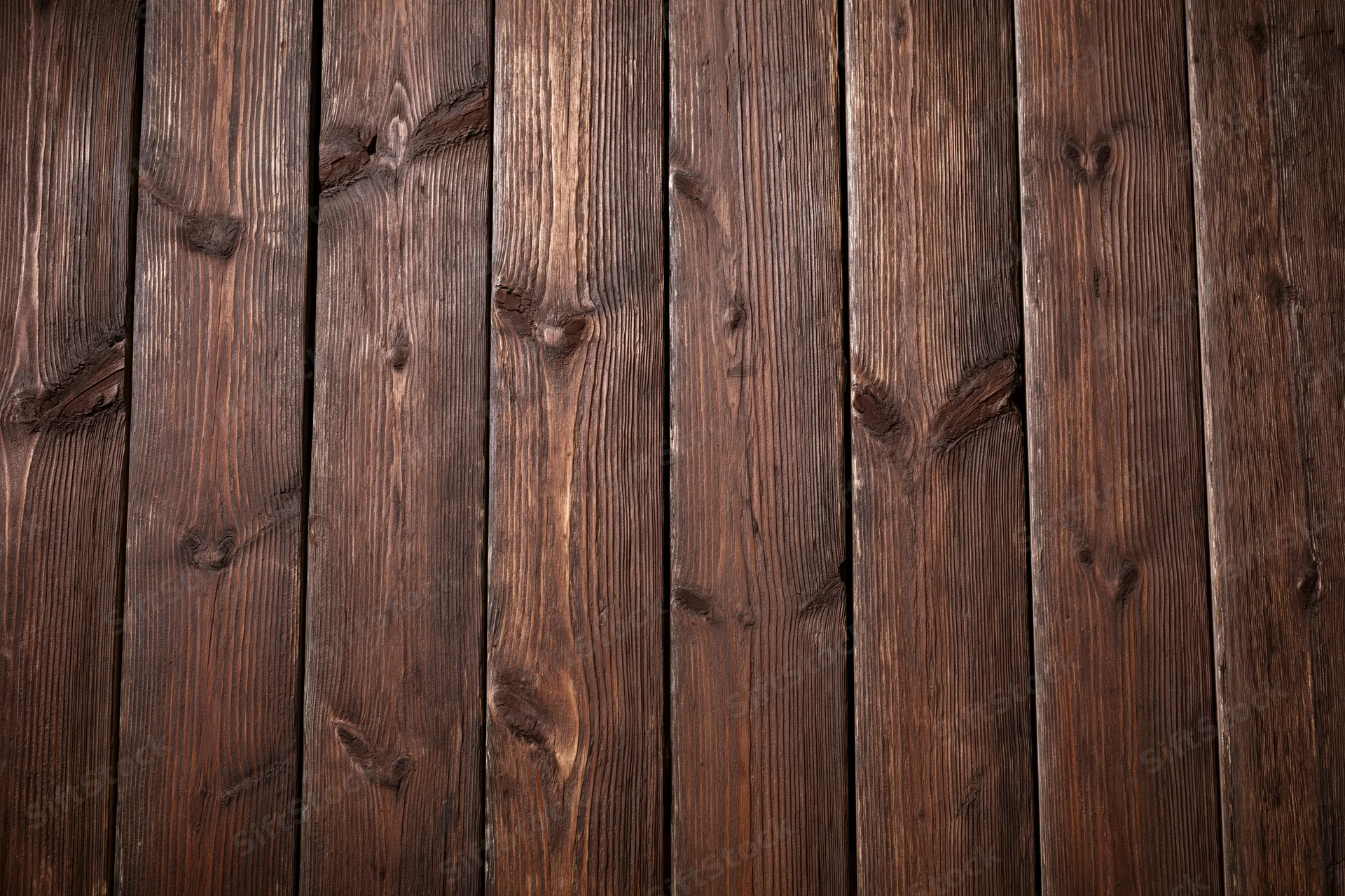 Vertical aged wooden planks arranged in a flat-lay pattern filling the frame