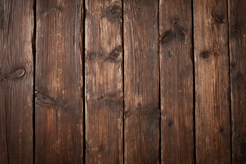 Vertical aged wooden planks arranged in a flat-lay pattern filling the frame