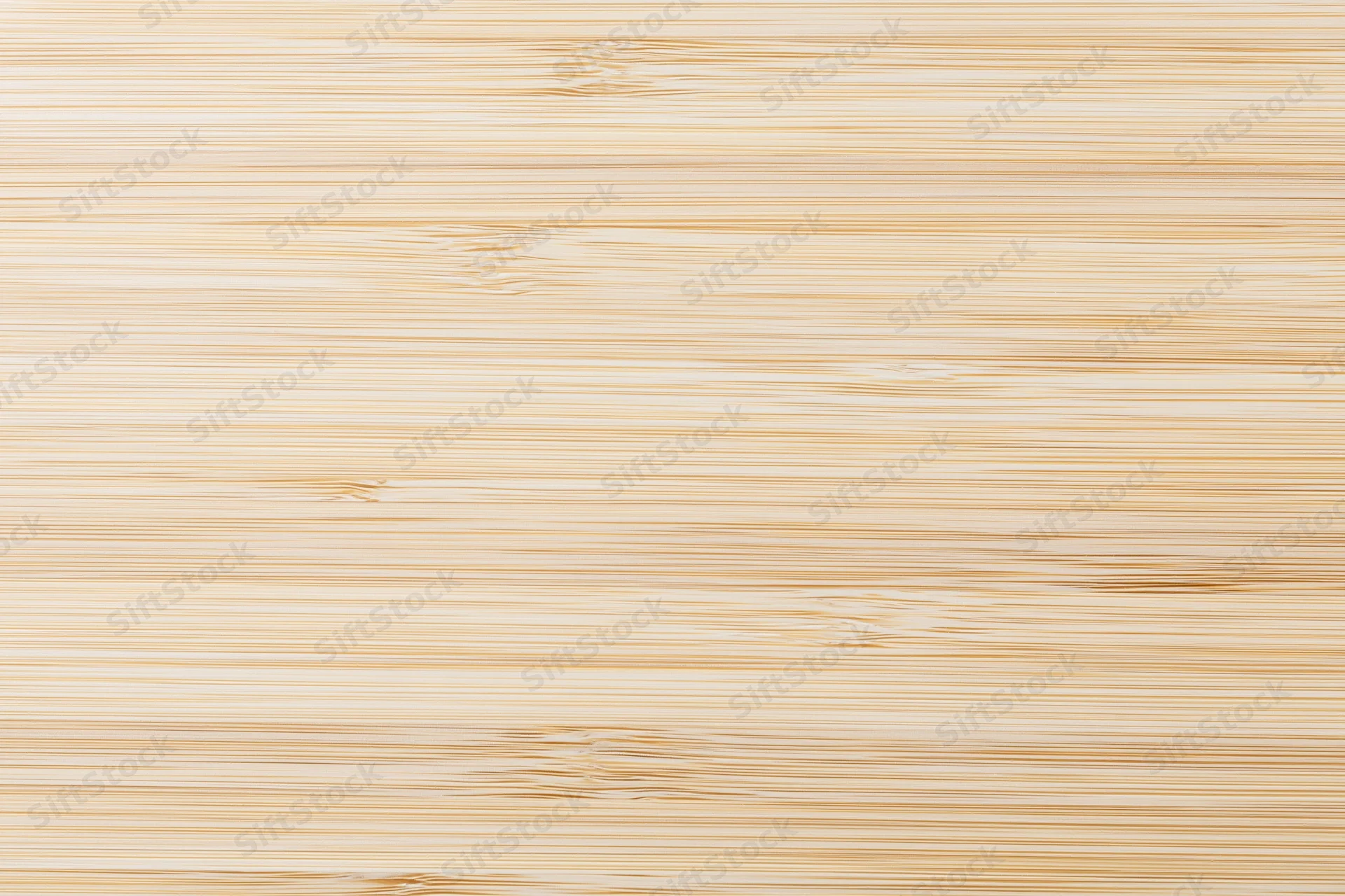 Close-up flat lay of a light bleached bamboo wood surface with horizontal grain pattern