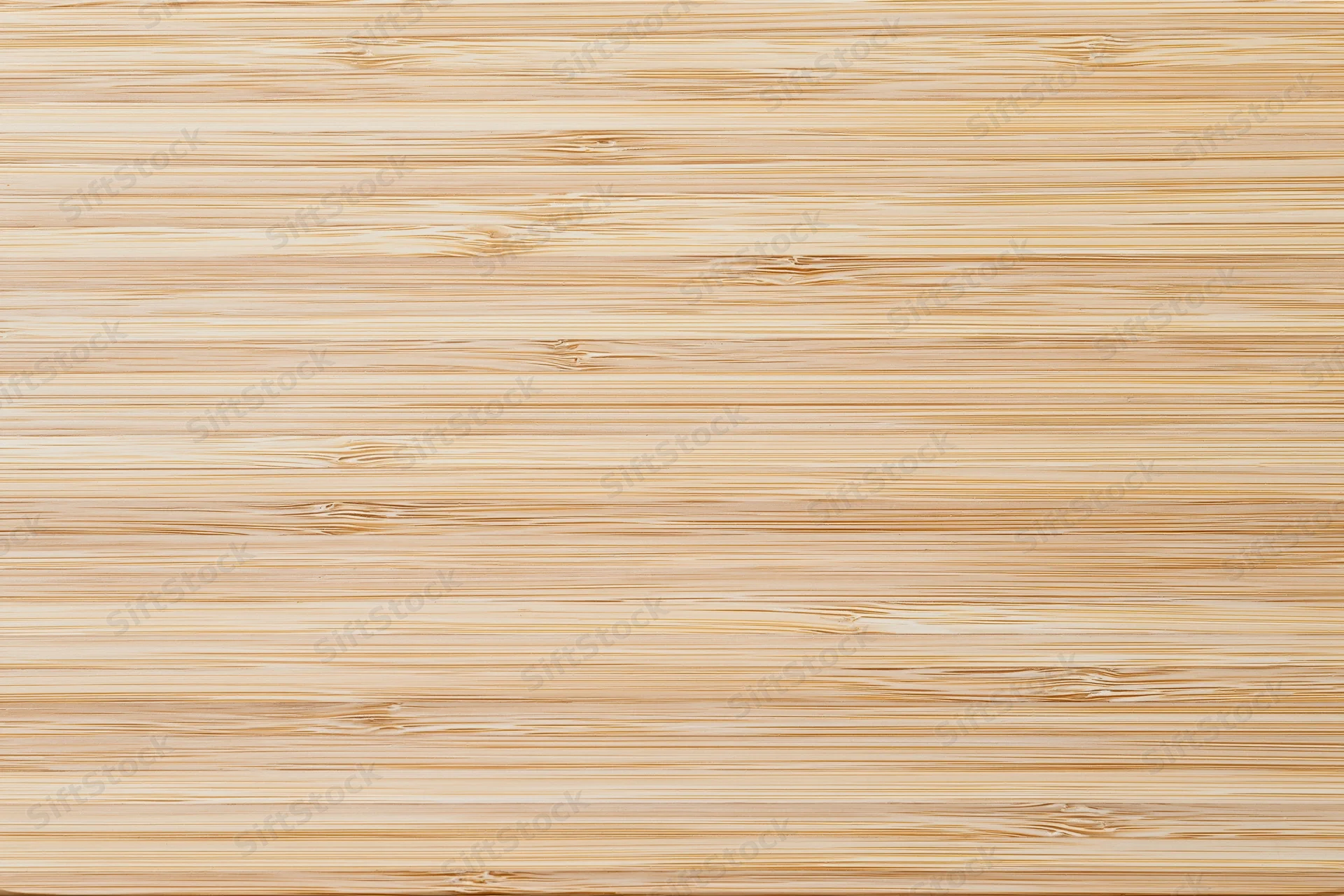 Close-up flat lay of a light bleached bamboo wood surface with horizontal grain pattern