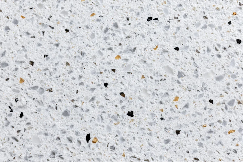 Polished terrazzo surface with embedded stone aggregate filling the frame
