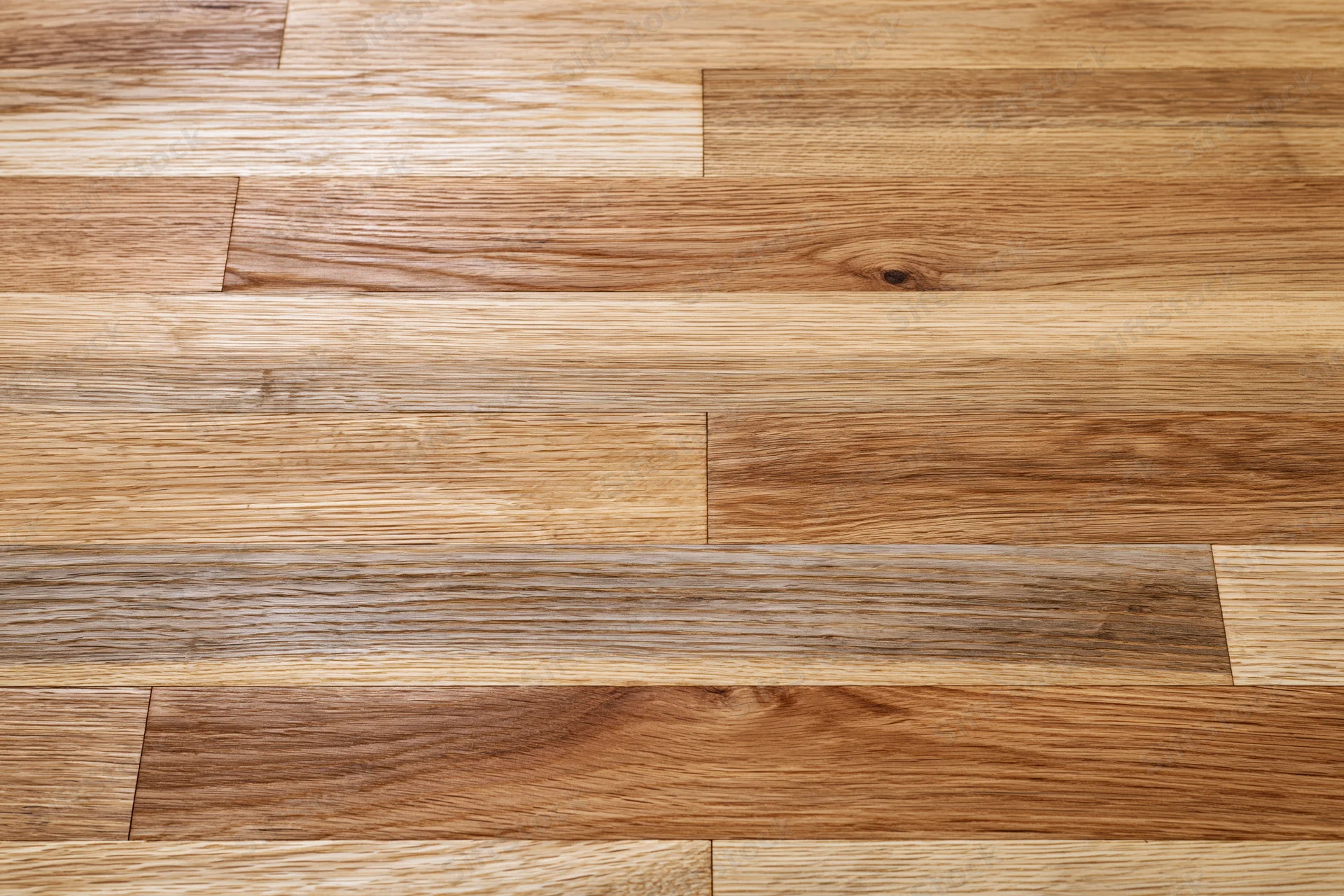 Close-up flat lay of hardwood parquet flooring filling the frame