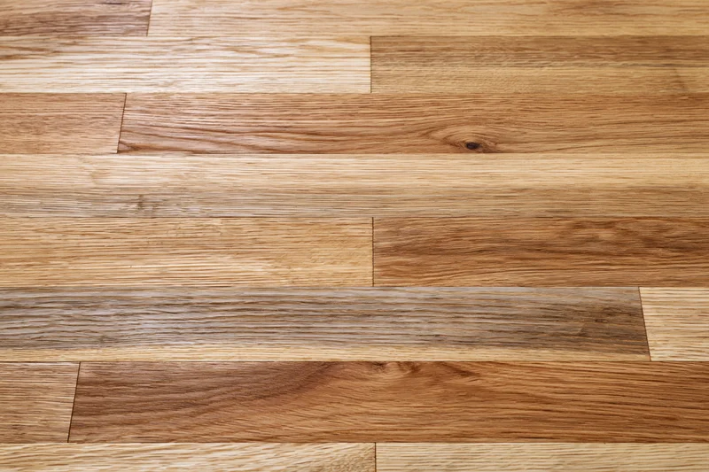 Close-up flat lay of hardwood parquet flooring filling the frame