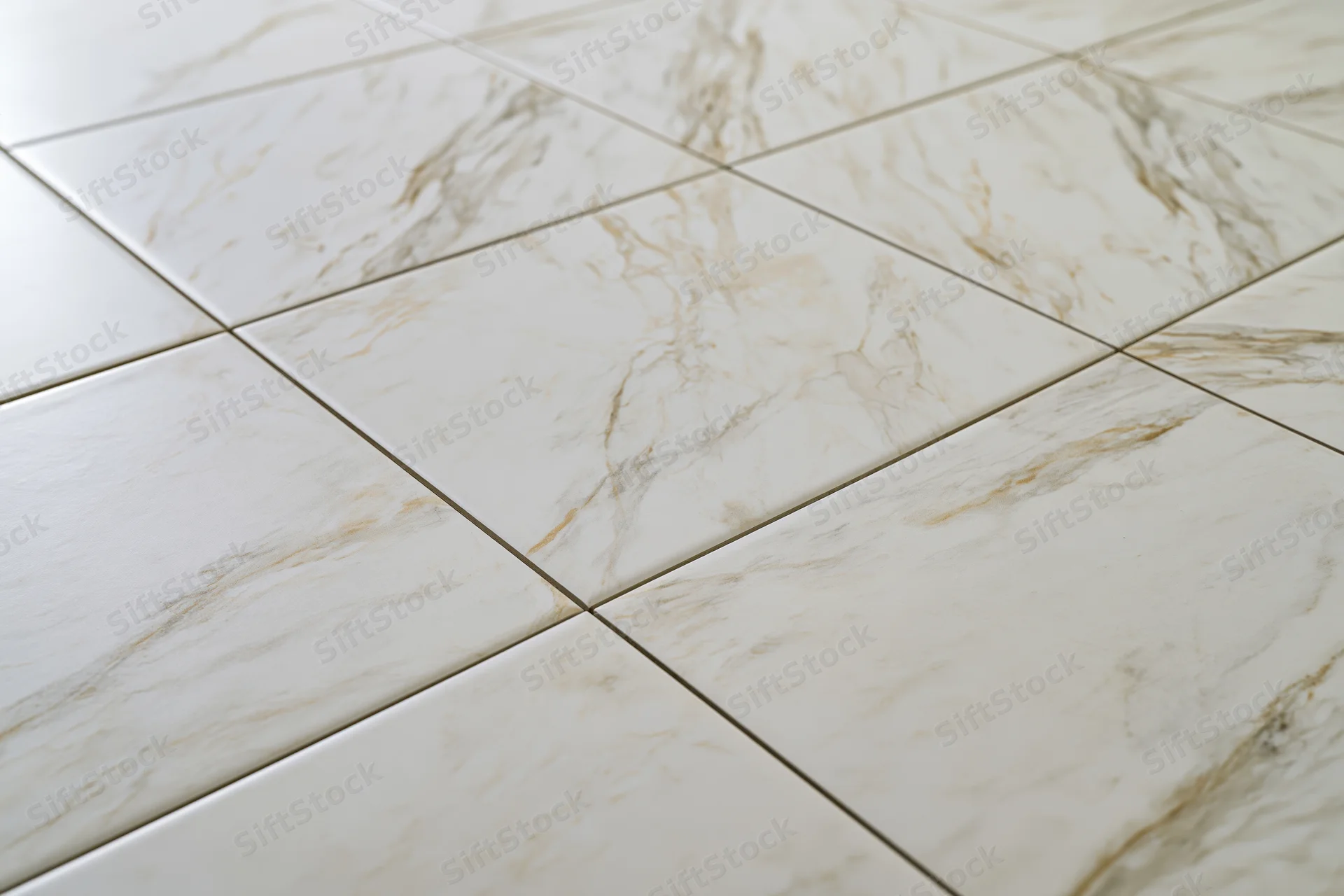 Large white marble floor tiles arranged in a grid pattern with visible grout lines