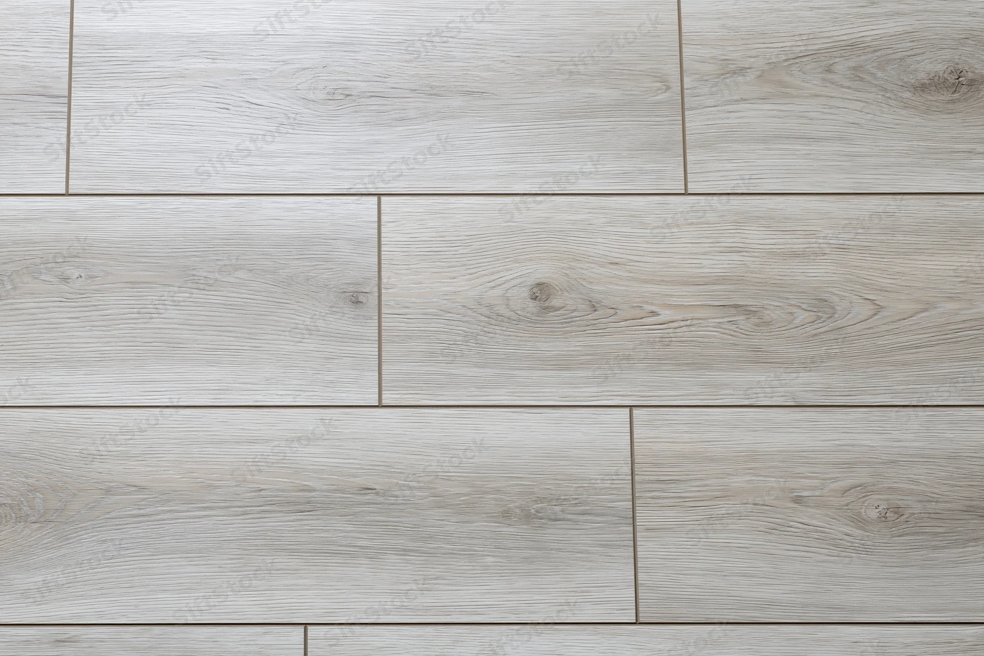 Light grey oak laminate flooring planks arranged in horizontal pattern for interior flooring