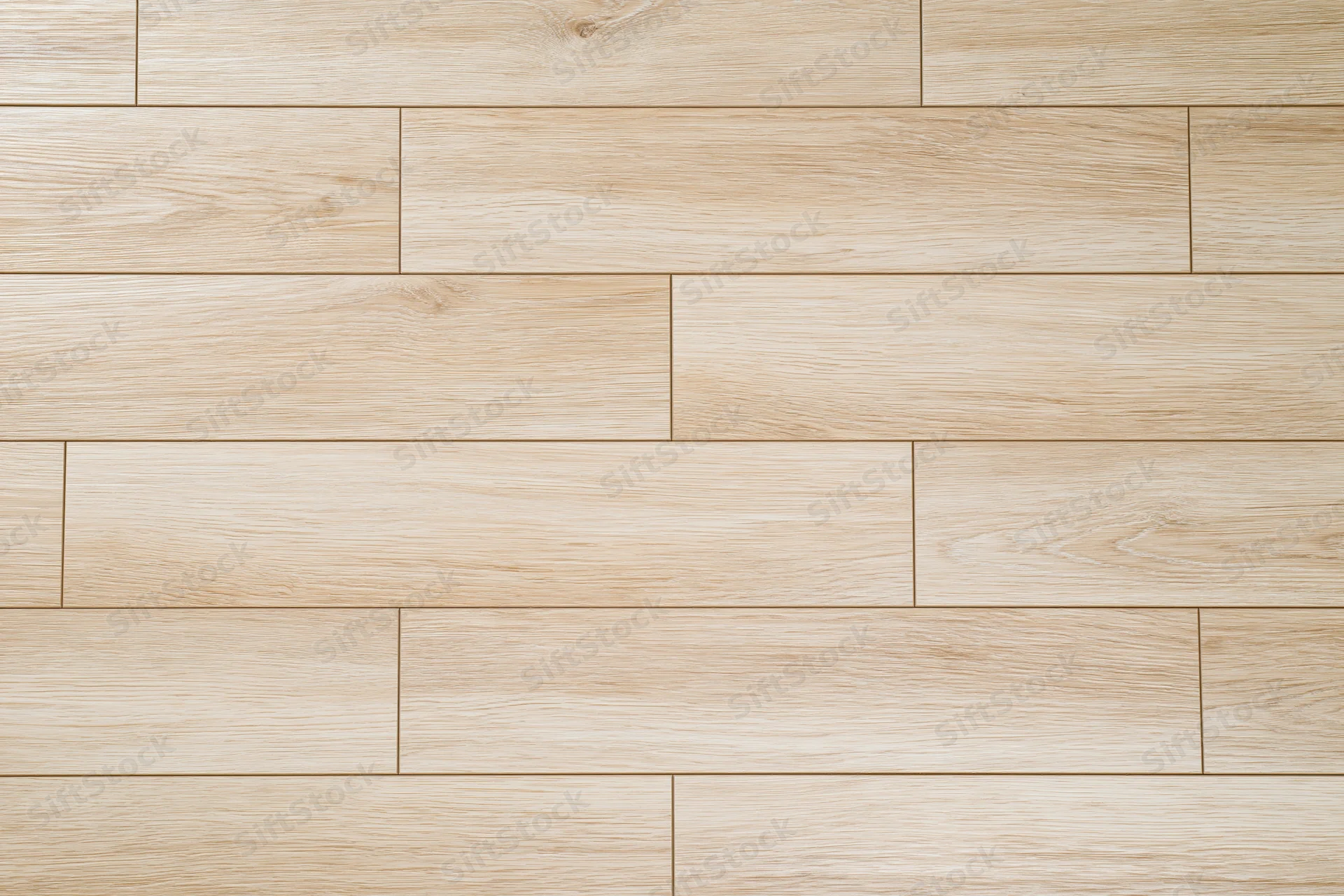 Light oak hardwood floor planks arranged in staggered pattern for interior flooring