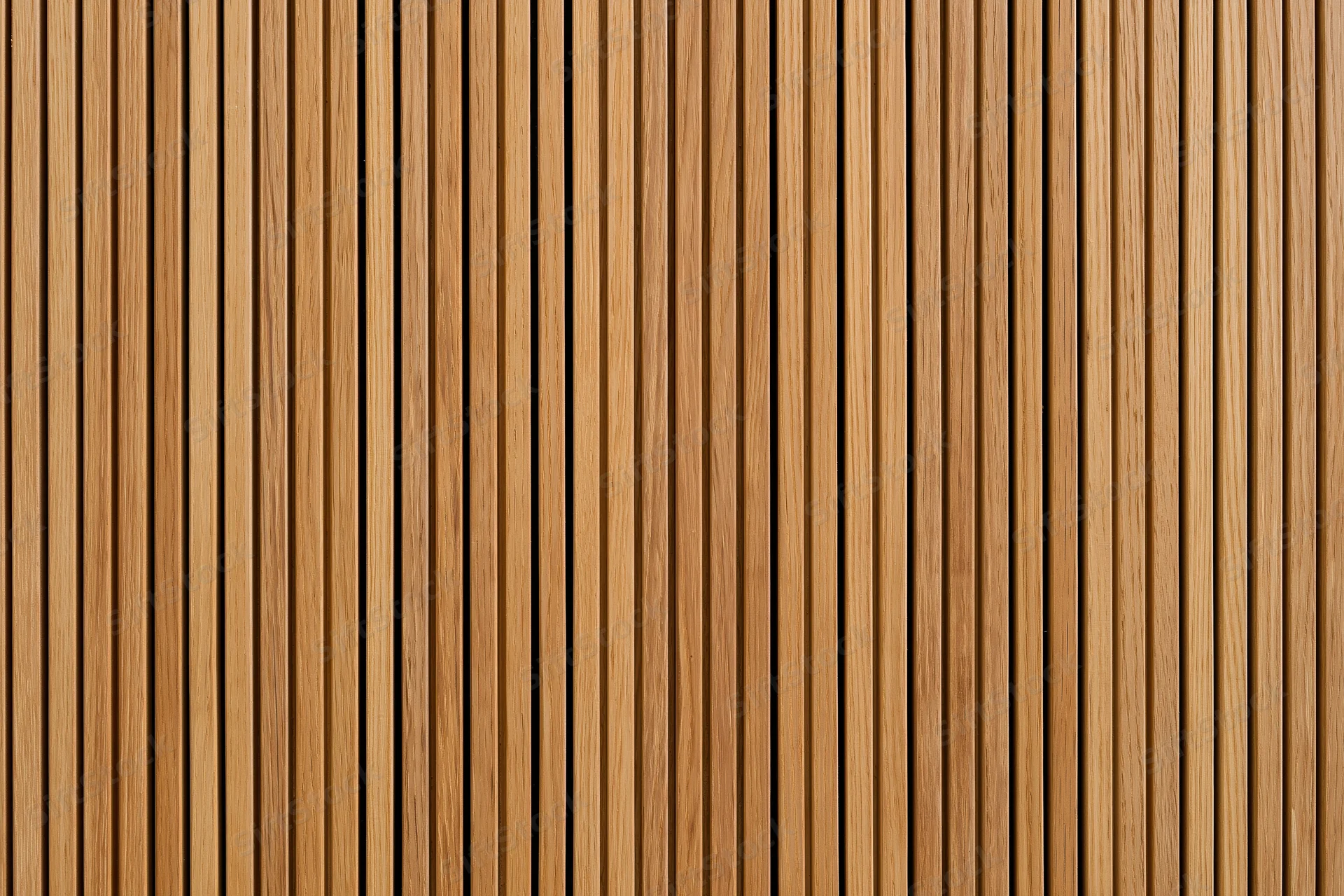 Vertical narrow wooden slats arranged in a flat pattern forming a textured surface