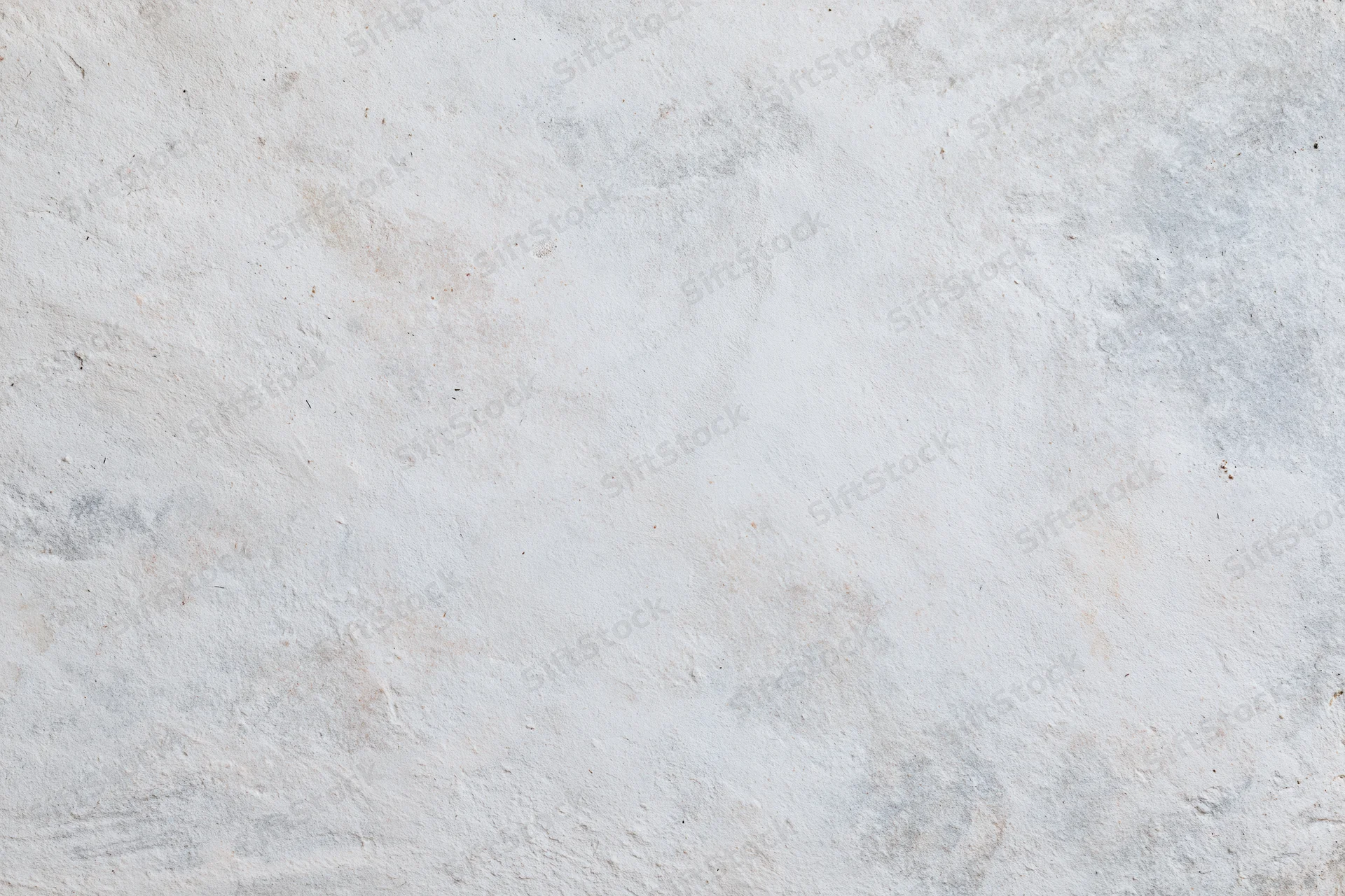 Smooth concrete wall surface filling the frame in a close-up flat shot